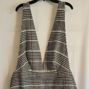 Plus size black and white houndstooth mini pinafore dress.